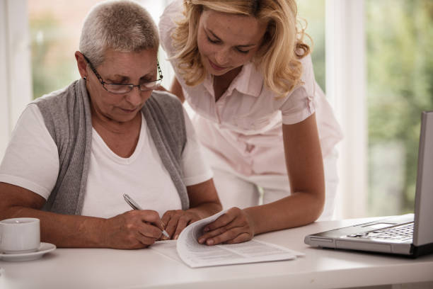 istock Senior woman working with a life insurance agent 1188839241