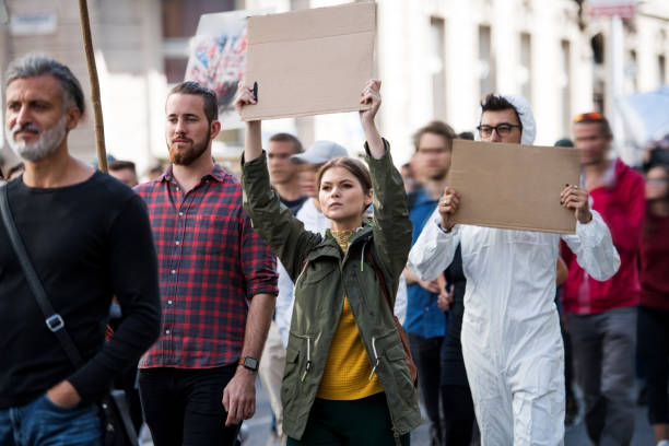 istock People with placards and posters on global strike for climate change. 1188839681