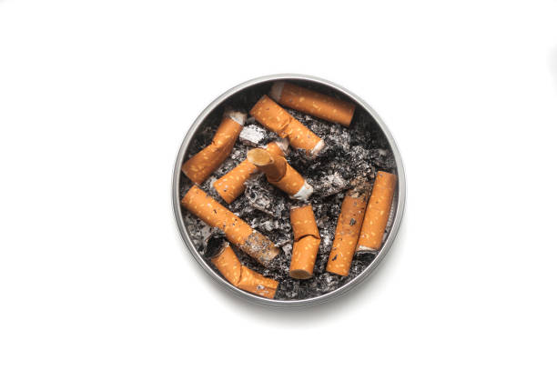 istock metallic ashtray full of cigarettes habits on white background 1188840588