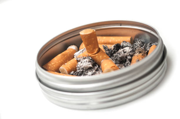 istock metallic ashtray full of cigarettes habits on white background 1188841163