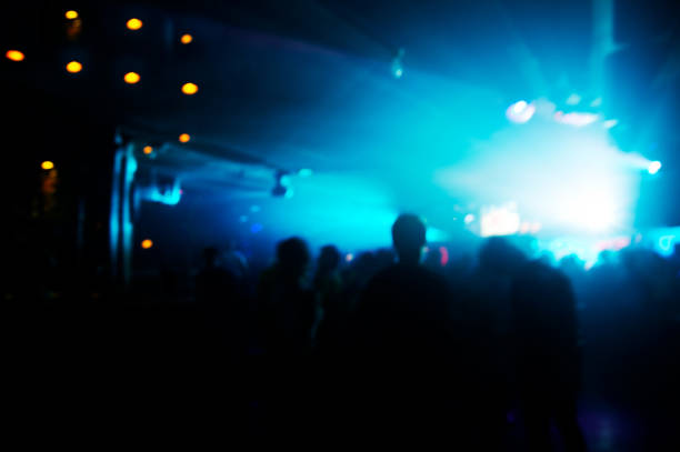 istock blue lamp light silhouette people in pub or bar dance party background 1188842668