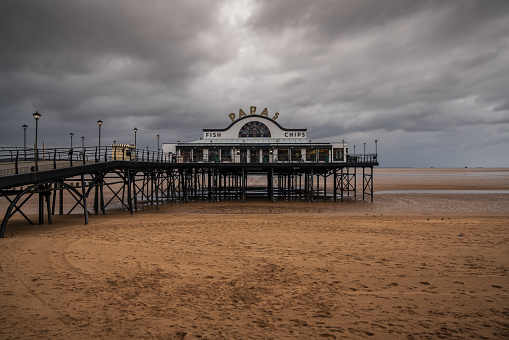 Cleethorpes, North East Lincolnshire, England, UK - April 27, 2019: Grey clouds over The Pier