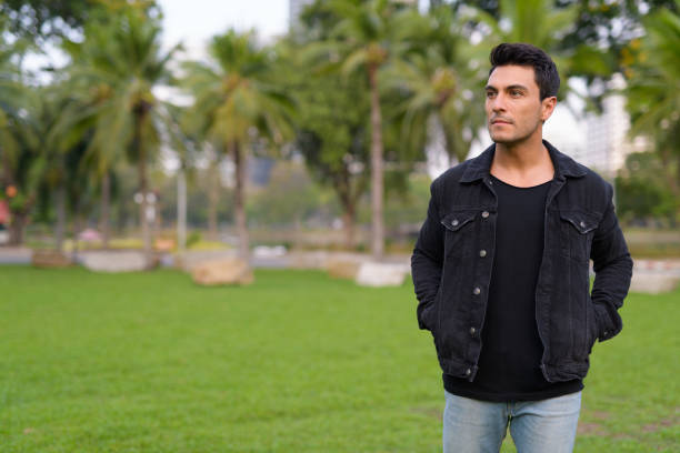 istock Young handsome Hispanic man thinking in the park outdoors 1188845470