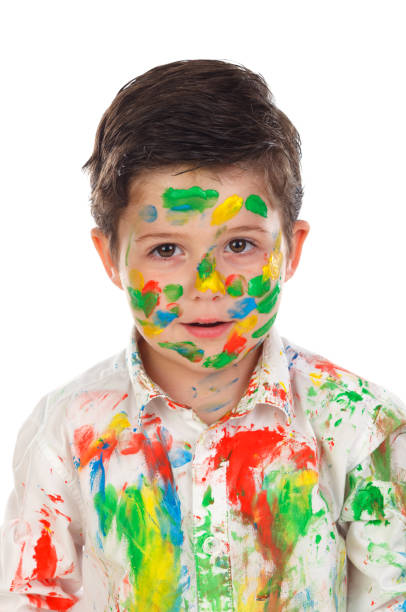 istock Funny boy with hands and face full of paint 1188846757