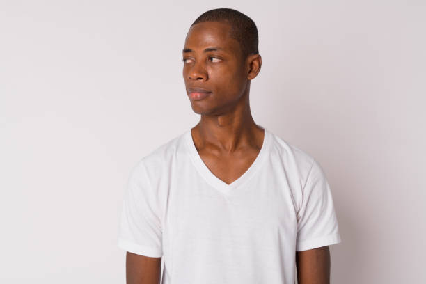 istock Face of young handsome bald African man thinking 1188847033