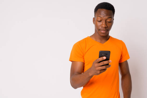istock Portrait of young handsome African man using phone 1188847292