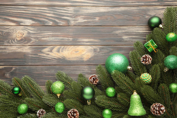 istock Christmas tree branches with green christmas decoration on a white background 1188847696