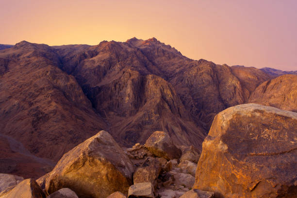 istock Beautiful view from the mountain. Panorama. Mountain range with visible silhouettes through the morning blue fog 1188848619
