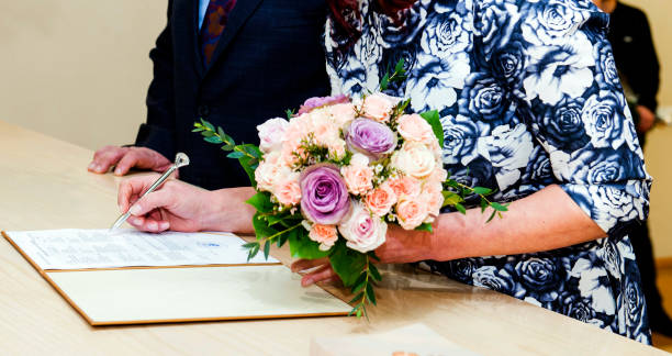 istock People of retirement age marry and sign a document 1188850698