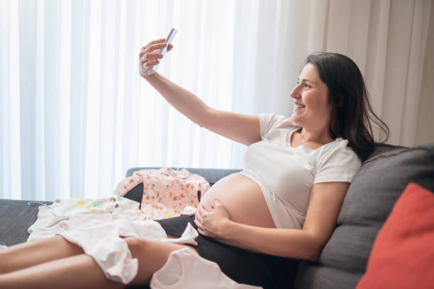 istock Baby clothes, taking photo 1188852120