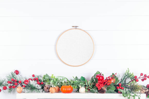 Making DIY Christmas decoration on wooden table. Creative hobbies