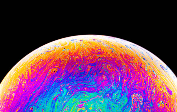 istock Rainbow soap bubble on a dark background. Close-up of colorful surface. 1188855703