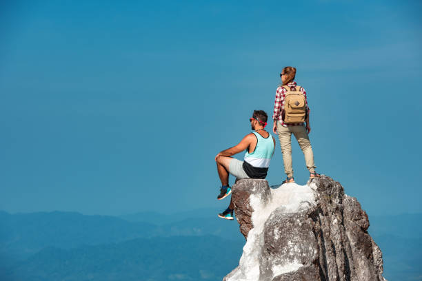 istock Two hikers relaxing on mountain top 1188856562