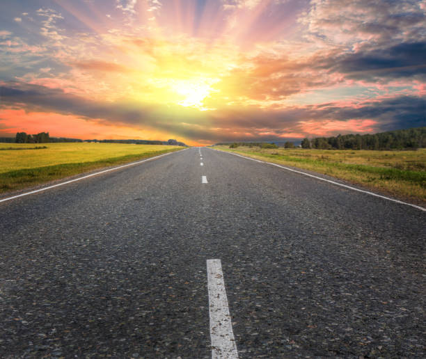 istock sunset over the country highway 1188856581