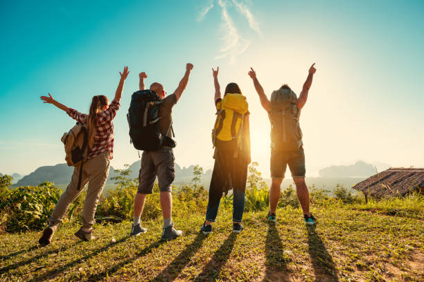 istock Four travelers or hikers backpack sunrise 1188856683