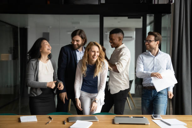 istock Overjoyed diverse colleagues having fun after workday at office. 1188857022