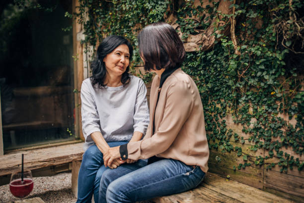 istock Senior women sitting in sidewalk cafe 1188858589