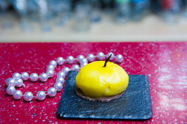 A piece of cake on a wooden tray..