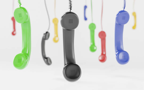 istock Red and multi-coloured telephone receiver hanging concept for on the phone, customer service, on hold or contact us 3d render illustration 1188860149