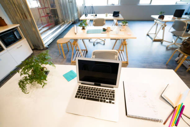 Clean and bright empty office with working office equipment waiting for workers