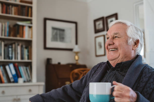 istock Senior rman lauging while relaxing with a coffee at home 1188861703