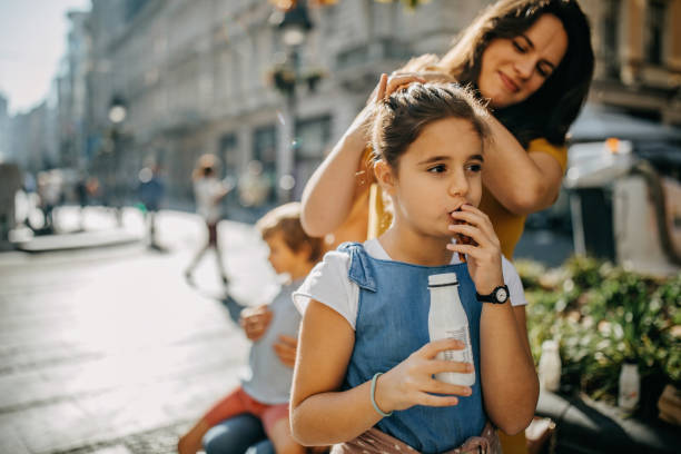 Mother daughter eating outdoor