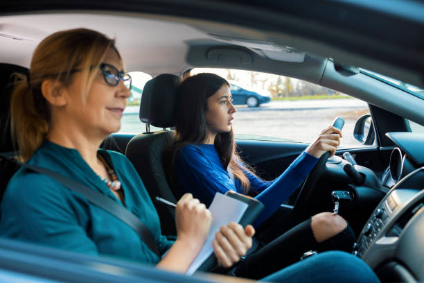 istock Teenager having driving lesson with female instructor 1188863264