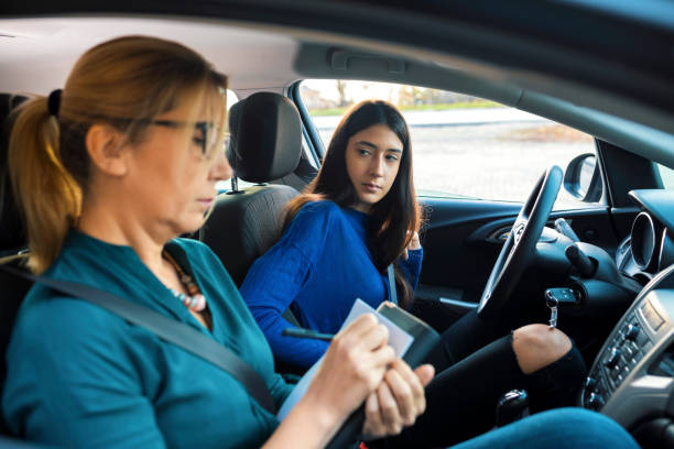 istock Teenager having driving lesson with female instructor 1188863278