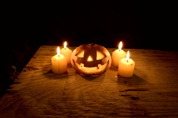 istock Pumpkin with candles on wooden 1188866205