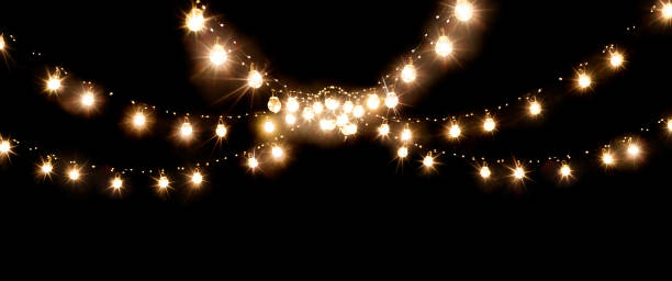 weihnachten der hochzeitslichter isoliert auf schwarz - lichterkette lichtquelle stock-fotos und bilder