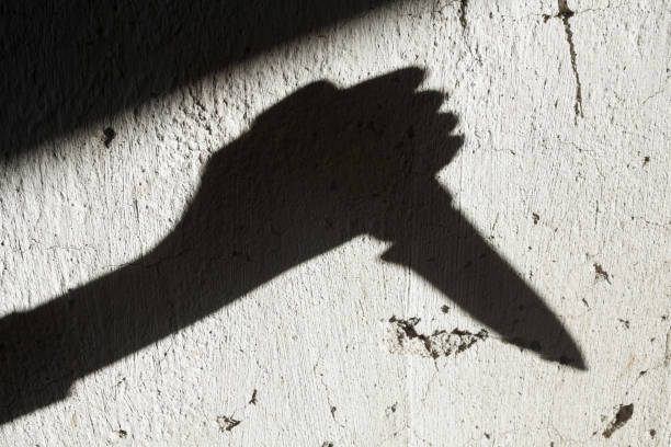 istock Shadow of the hand holding a knife 1188869234