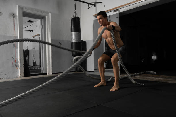 istock Fit muscular bodybuilder man exercising in the gym 1188870521