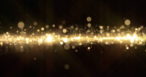 istock Gold glitter, light particles shine bokeh effect, shimmering magic bright glare. Shining gold glitter sparks and glittering sparkling light glow on black background 1188870685