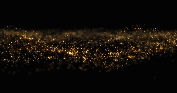 istock Gold glitter particles wave background, shining gold sparks and yellow glittery bokeh light. Gold glow and shimmering sparkles shine, abstract magic bright sparks in wave motion 1188870703