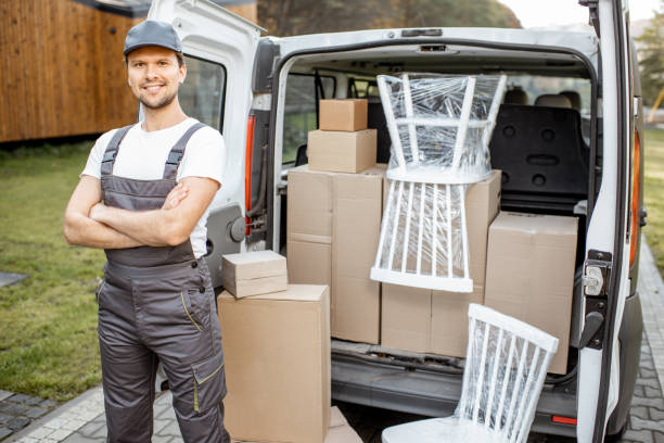 istock Handsome delivery man near the car trunk 1188871556