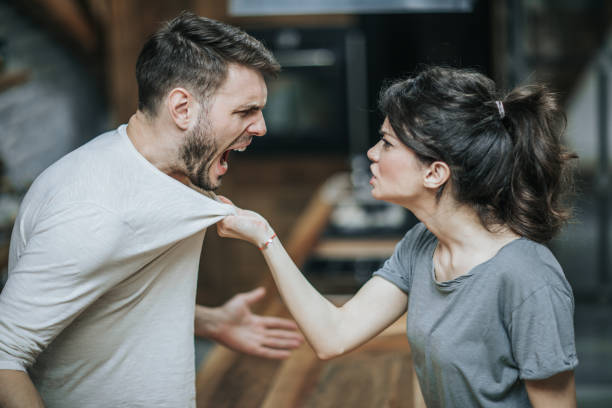 istock Aggressive couple arguing about their problems at home. 1188872173