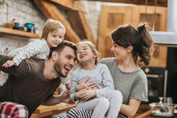 istock Cheerful family having fun during morning time in the kitchen. 1188873373
