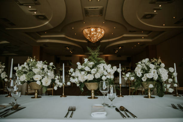 istock Wedding banquet tables with flowers decoration 1188873889