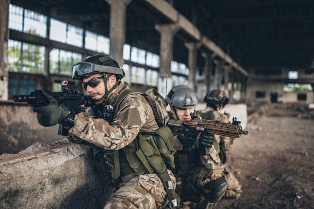 istock Soldiers on a mission in abandoned warehouse 1188876493