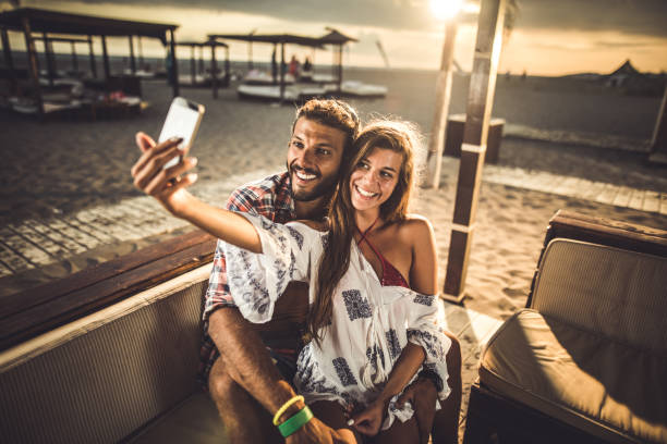 istock Young loving couple taking a selfie with smart phone. 1188876916