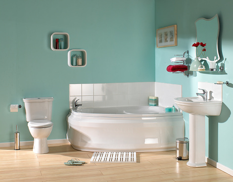 Interior of a contemporary bathroom with washstand and bathtube.