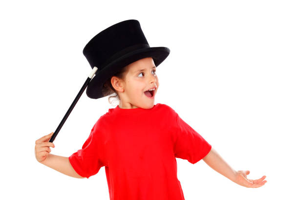 Happy kid trying a magical trick feeling like a wizard