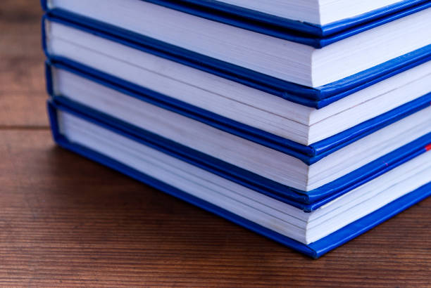 istock Stack of books on wooden background 1188877686