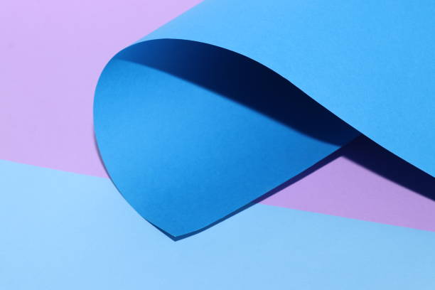 istock Beautiful multicolored background with rolled-up paper. Blue, lilac and mint. 1188878762