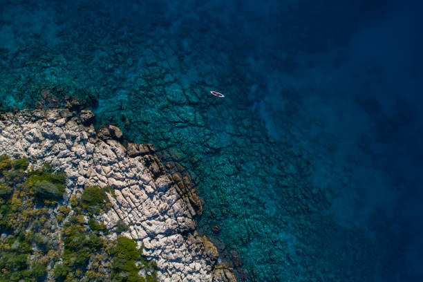 istock Woman kayaking clear turquoise sea 1188879627