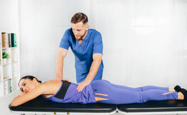 istock Osteopath Massaging woman back, vertebrae treatment 1188880190