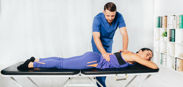 istock Osteopath Massaging woman back, vertebrae treatment 1188880194