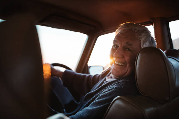 istock Smiling senior man going for a drive at sunset 1188881160