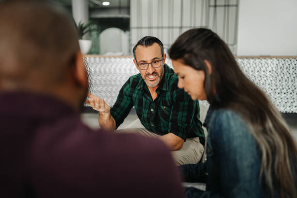 istock Handsome businessman in discussion with diverse business team analyzing financial data 1188882004