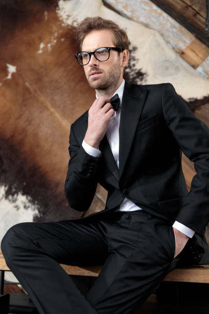 istock Concerned groom fixing his bowtie with his hand in pocket 1188883007